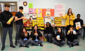 Students pose with nonperishable food items